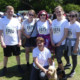 Hine Solicitors Wills and Probate team and supporters with their race numbers at the Gerrards Cross fun run