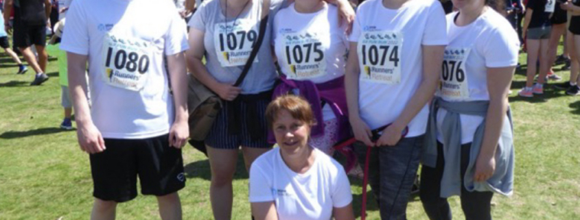 Hine Solicitors Wills and Probate team and supporters with their race numbers at the Gerrards Cross fun run