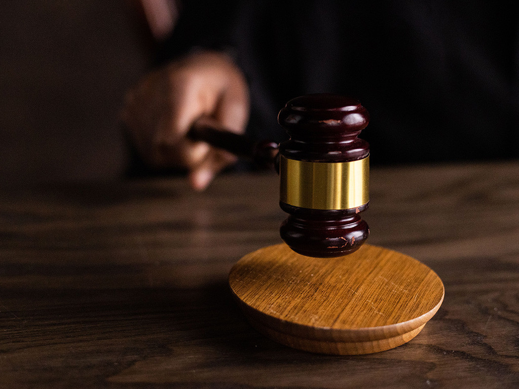 Judge's gavel striking its block
