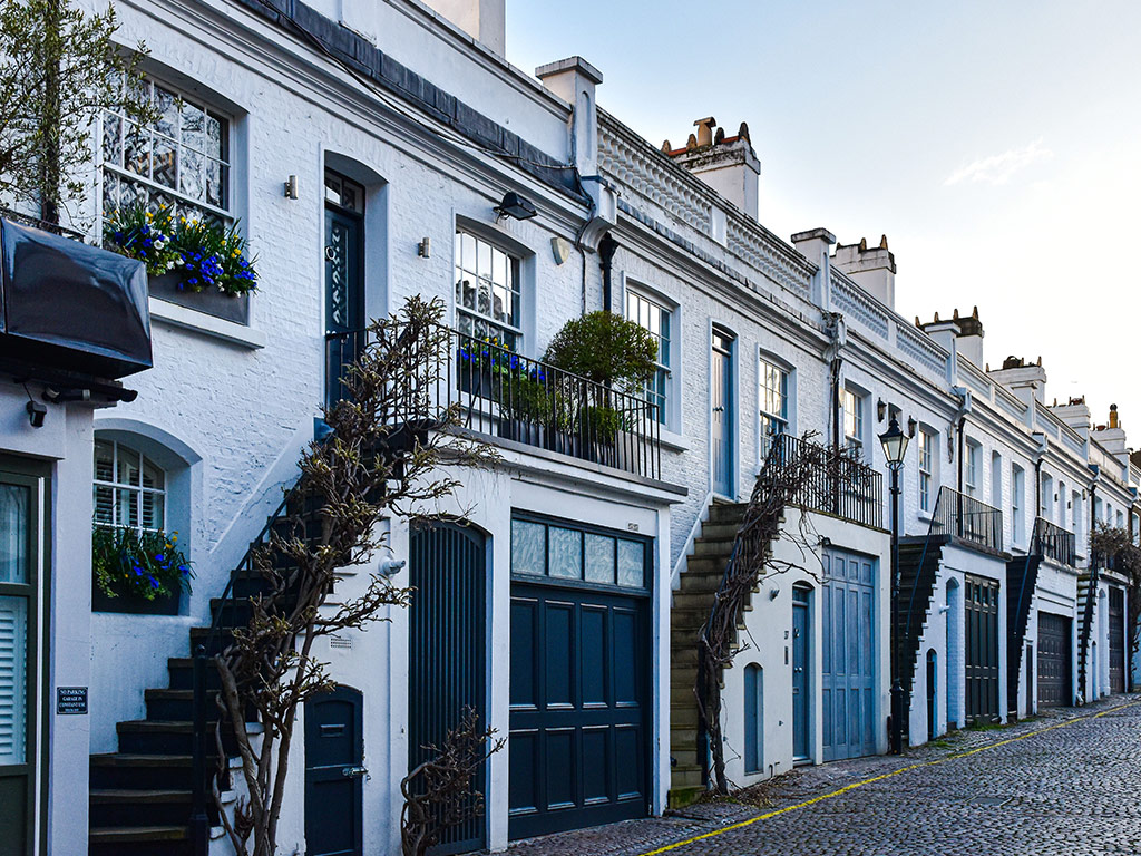 Row of white terraced mews houses