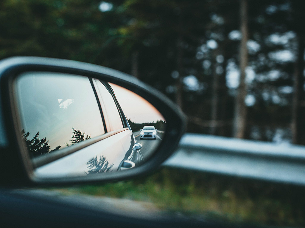 Car following behind, seen in a wing mirror