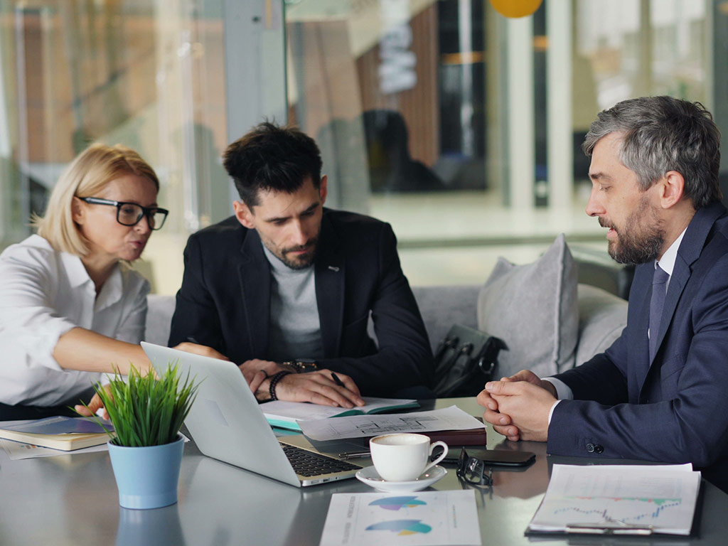 Three colleagues in a business meeting